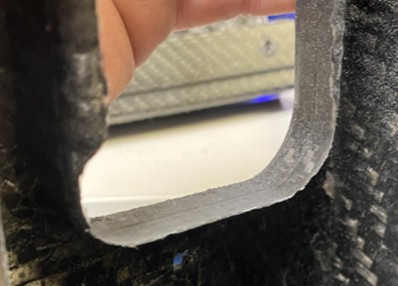 Composite edge after heavy burr removal using a diamond point
