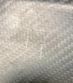Composite surface mark before polishing with felt point and compound