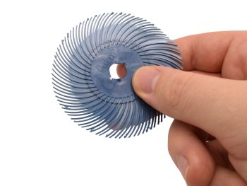 Dedeco Sunburst 3 inch TC radial disc held by hand to show size and flexibility