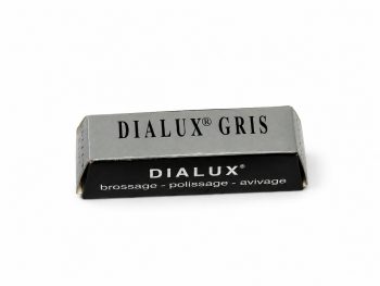 Dialux Gris grey polishing compound bar in grey and black packaging on a white background.