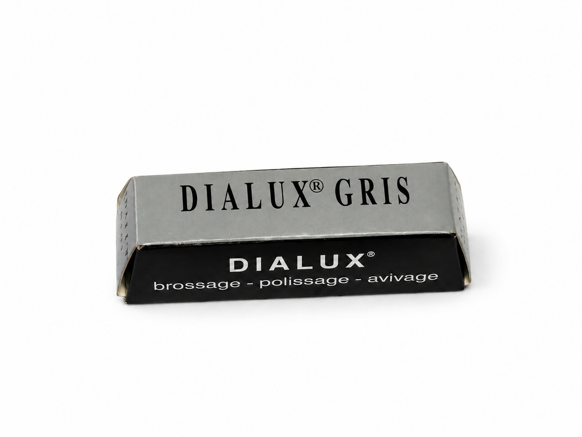 Dialux Gris grey polishing compound bar in grey and black packaging on a white background.