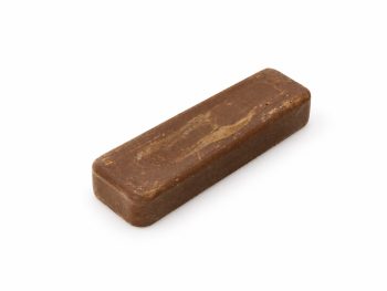 Small 4 x 1 inch brown Tripmax polishing compound bar on a white background.