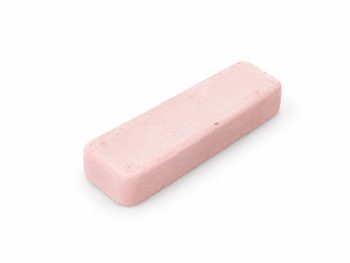 Small 4 x 1 inch pink Chromax polishing compound bar on a white background.