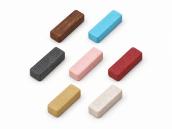 Seven small 4 x 1 inch polishing compound bars in brown, blue, black, pink, rouge, buff and white, arranged in three rows on a white background.